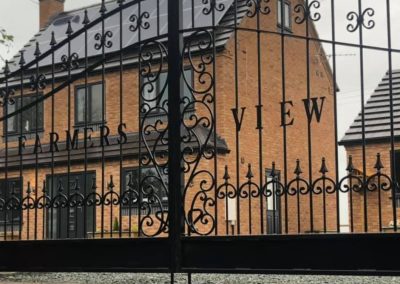 Gates with ornate spirals and finials